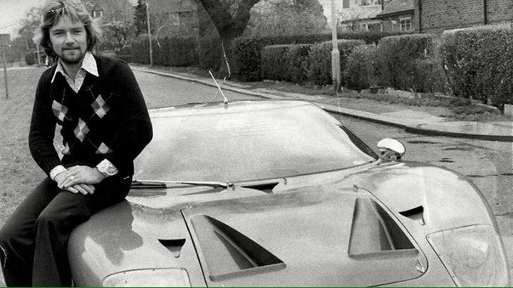 A young Noel Edmonds sitting on the bonnet of a Ford GT40